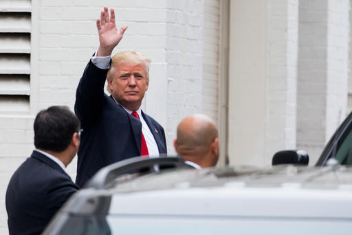 Republican presidential candidate Donald Trump waves as he arrives for a meeting with House Speaker Paul Ryan of Wis., at the Republican National Committee Headquarters on Capitol Hill in Washington, Thursday, May 12, 2016. 
