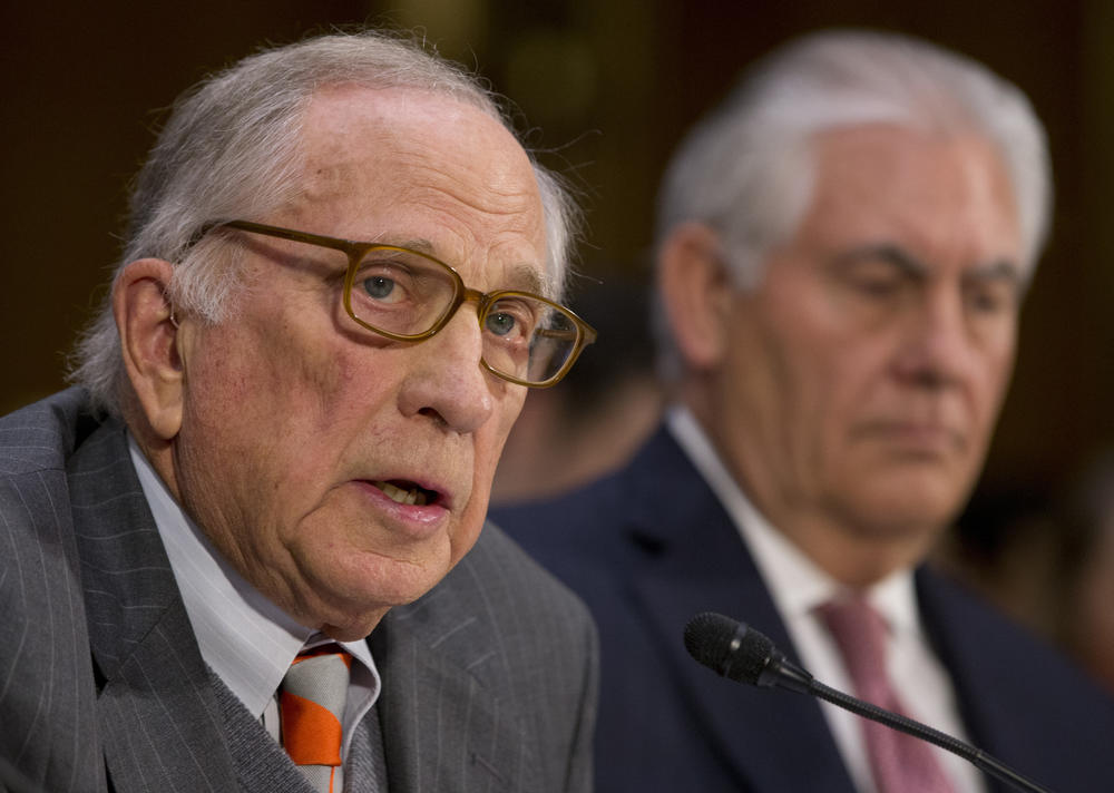 Secretary of State-designate Rex Tillerson listens as right as former Georgia Sen. Sam Nunn introduces him on Capitol Hill in Washington, Wednesday, Jan. 11, 2017, during Tillerson's confirmation hearing before the Senate Foreign Relations Committee. 