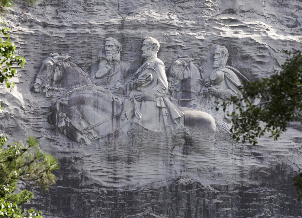 This June 23, 2015 file photo shows the carving depicting Confederate Civil war figures Stonewall Jackson, Robert E. Lee and Jefferson Davis, in Stone Mountain, Ga. 