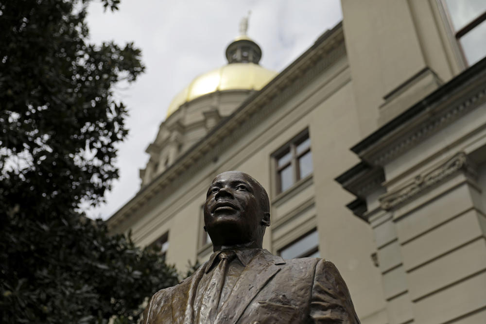 A statue of civil rights leader Martin Luther King Jr. stands at the State Capitol in Atlanta.