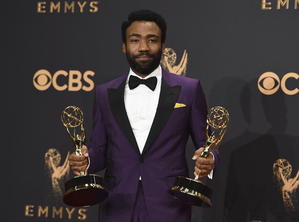 Donald Glover poses in the press room with his awards for outstanding lead actor in a comedy series and for outstanding directing for a comedy series for 