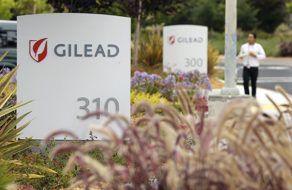 A man walks outside the headquarters of Gilead Sciences in Foster City, Calif. Gilead Sciences Inc. 
