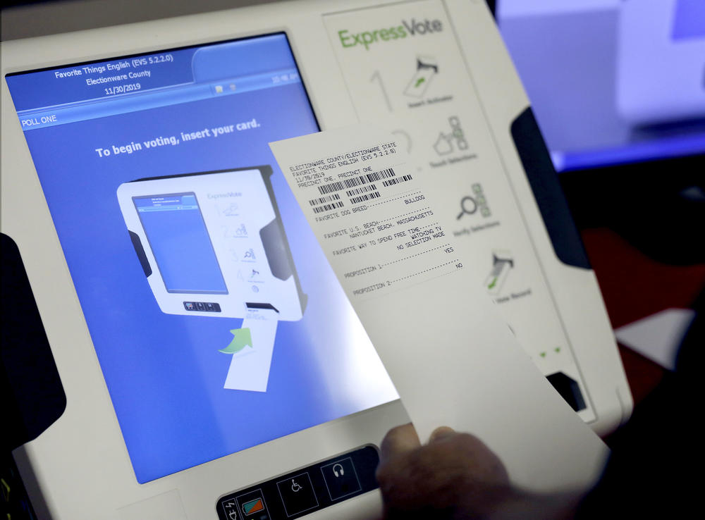 A new voting machine which prints a paper record sits on display at a polling site in Conyers, Ga.