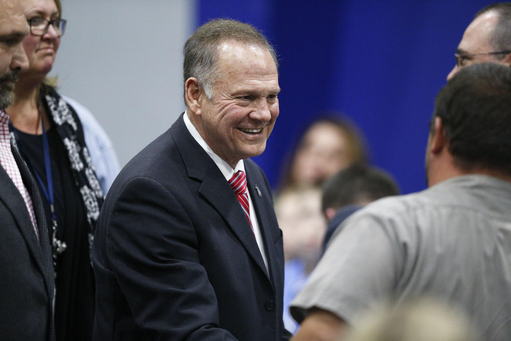 Former Alabama Chief Justice and U.S. Senate candidate Roy Moore walks out after he speaks at a revival, Tuesday, Nov. 14, 2017, in Jackson, Ala.