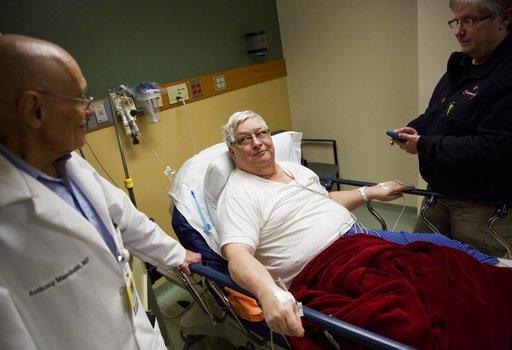 Ken McCarty, center, and his wife Martha Anne, right, talk to Dr. Anthony Marchetti while being treated for the flu at Upson Regional Medical Center in Thomaston, Ga., Friday, Feb. 9, 2018.