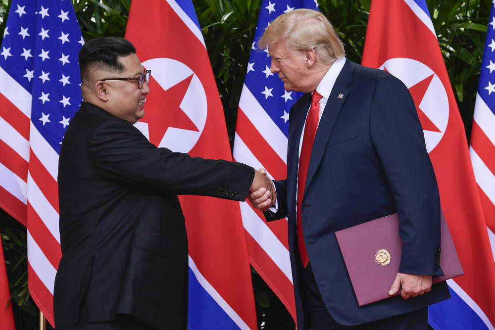 North Korea leader Kim Jong Un and U.S. President Donald Trump shake hands at the conclusion of their meetings at the Capella resort on Sentosa Island Tuesday, June 12, 2018 in Singapore.