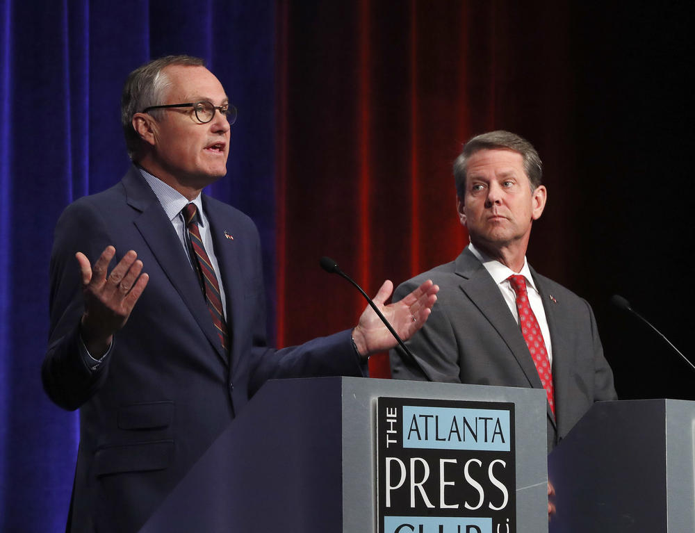 Republican candidates for Georgia Governor Georgia Lt. Gov. Casey Cagle, left, and Secretary of State Brian Kemp speak during an Atlanta Press Club debate at Georgia Public Television Thursday, July 12, 2018, in Atlanta.