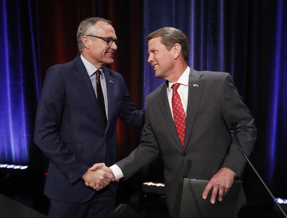 In this July 12, 2018, file photo, Georgia Republican gubernatorial candidates, Lt. Gov. Casey Cagle, left, and Secretary of State Brian Kemp shake hands after an Atlanta Press Club debate at Georgia Public Television in Atlanta.