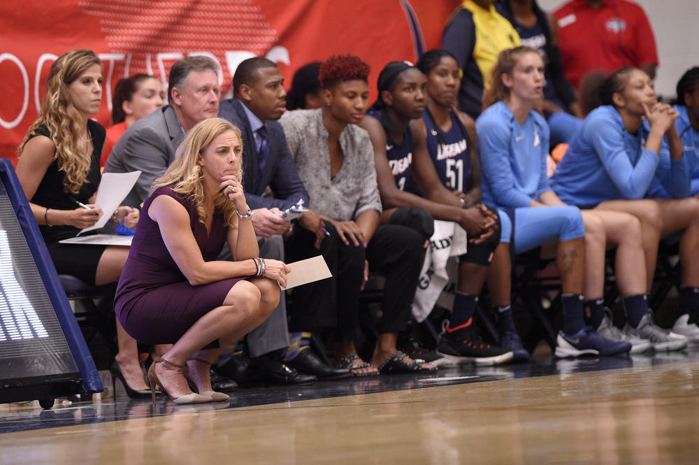 Atlanta Dream head coach Nicki Collen, left, watches during the first half of Game 3 of a WNBA semifinals basketball playoff game against the Washington Mystics, Friday, Aug. 31, 2018, in Washington.