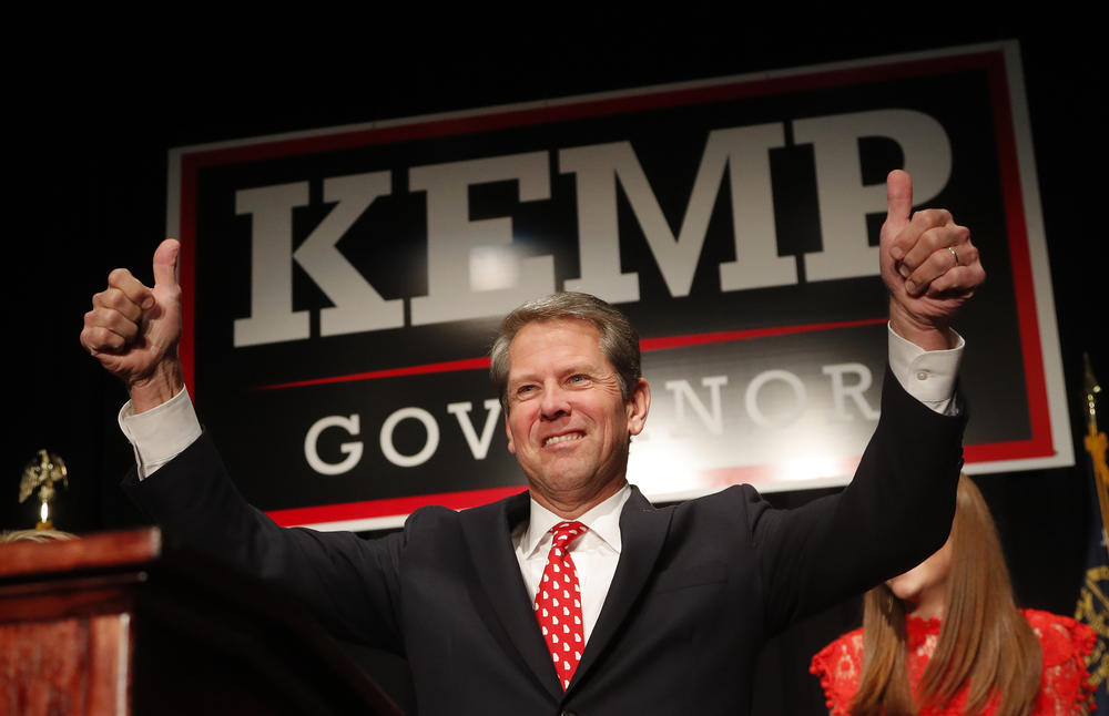 Georgia Republican gubernatorial candidate Brian Kemp gives a thumbs-up to supporters, Wednesday, Nov. 7, 2018, in Athens, Ga. 