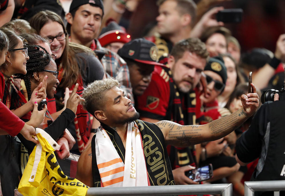 Martinez celebrated with fans after the United defeated the New York Red Bulls in the MLS playoffs.