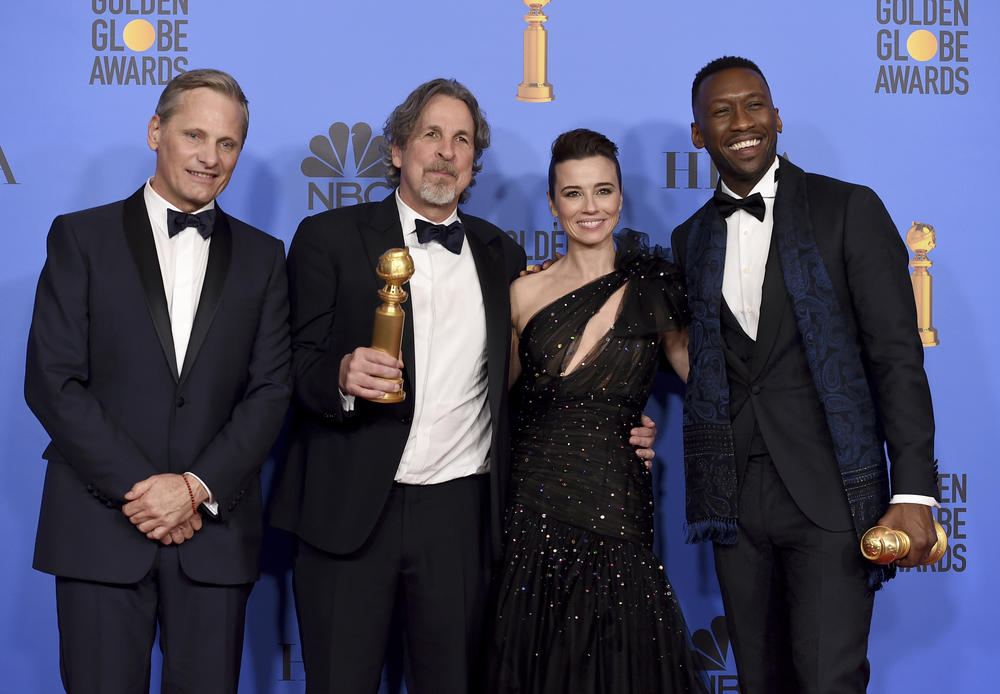 Viggo Mortensen, from left, Peter Farrelly, Linda Cardellini and Mahershala Ali pose in the press room with the award for best motion picture, musical or comedy for "Green Book" at the 76th annual Golden Globe Awards.