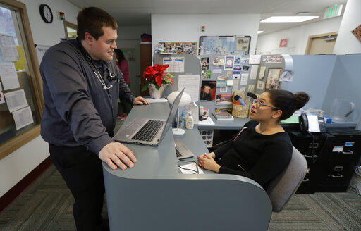 Dr. Alex Kivimaki, left, talks with Dr. Andrea Bachhuber-Beam, as they work at a clinic offering health care and other services operated by the Seattle Indian Health Board, Friday, Jan. 11, 2019, in Seattle.