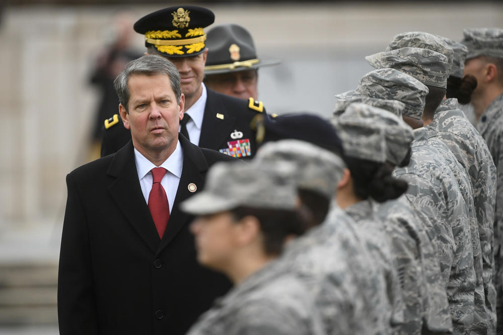 Georgia Gov. Brian Kemp, front left, reviews National Guard troops outside the state Capitol after being sworn-in on Inauguration Day, Monday, Jan. 14.