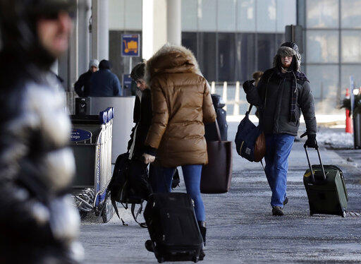 Passengers walk through Terminal 3 at O'Hare International Airport in Chicago, Thursday, Jan. 31, 2019. 