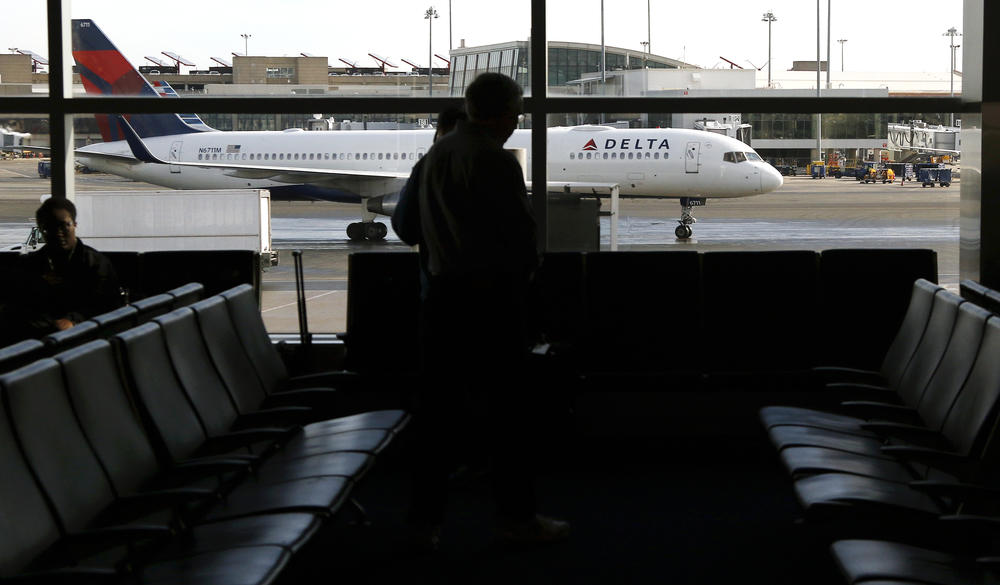 In this Feb. 1, 2019, file photo, a Delta Air Lines jetliner taxis at Logan International Airport in Boston. Delta will temporarily suspend service at 10 airports starting May 13, 2020.
