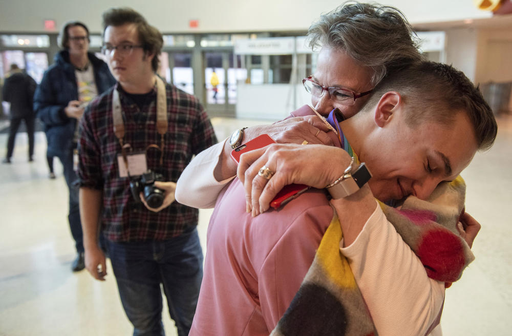 JJ Warren of New York embraces Julie Arms Meeks of Atlanta during protests outside the United Methodist Church's 2019 Special Session of the General Conference in St. Louis, Mo., Tuesday, Feb. 26, 2019. 