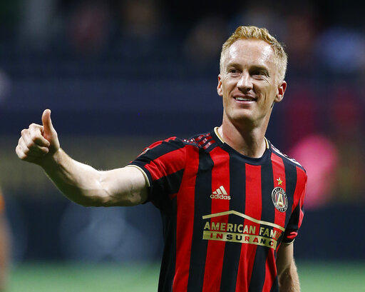 Atlanta United midfielder Jeff Larentowicz gestures to the crowd after the team's MLS soccer match against Toronto FC in Atlanta on Wednesday, May 8, 2019.