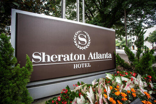The sign at the entrance to the Sheraton Atlanta Hotel is seen on Wednesday, July 31, 2019, in Atlanta, Georgia. The hotel was shut down voluntarily in July of 2019 after three guests tested positive for Legionnaires' disease.