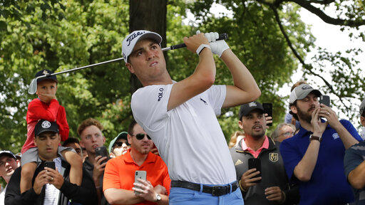 Justin Thomas hits his second shot on the first hole during the final round of the BMW Championship golf tournament at Medinah Country Club, Sunday, Aug. 18, 2019, in Medinah, Ill. 