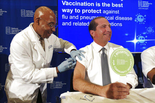 Secretary of Health and Human Services Alex Azar gerts a flu shot during a news conference in Washington D.C.
