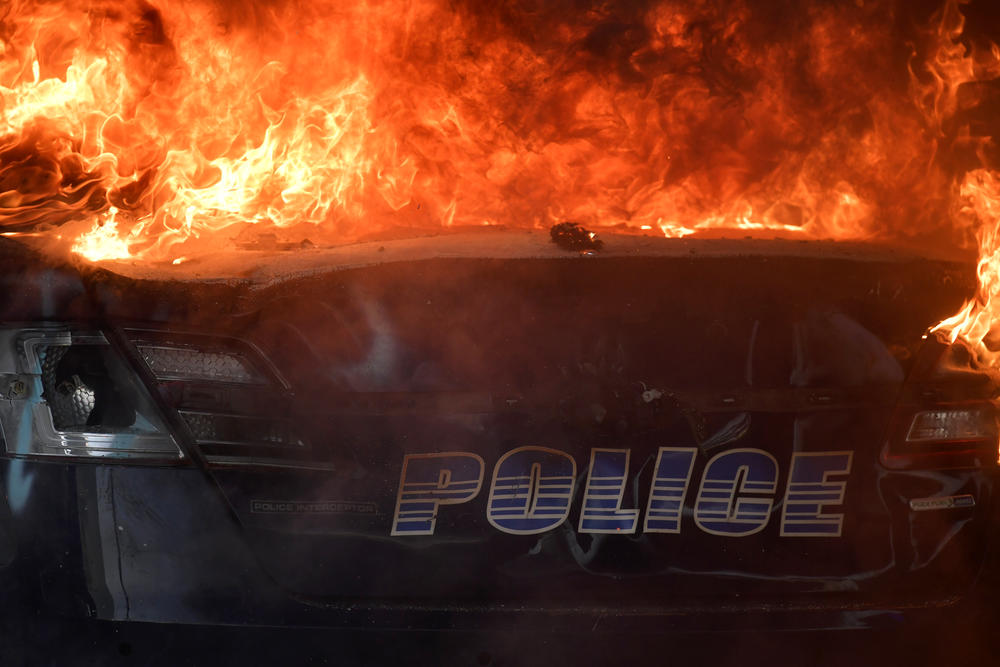 An Atlanta Police Department vehicle burns during a demonstration against police violence, Friday, May 29, 2020 in Atlanta. The protest started peacefully earlier in the day before demonstrators clashed with police.