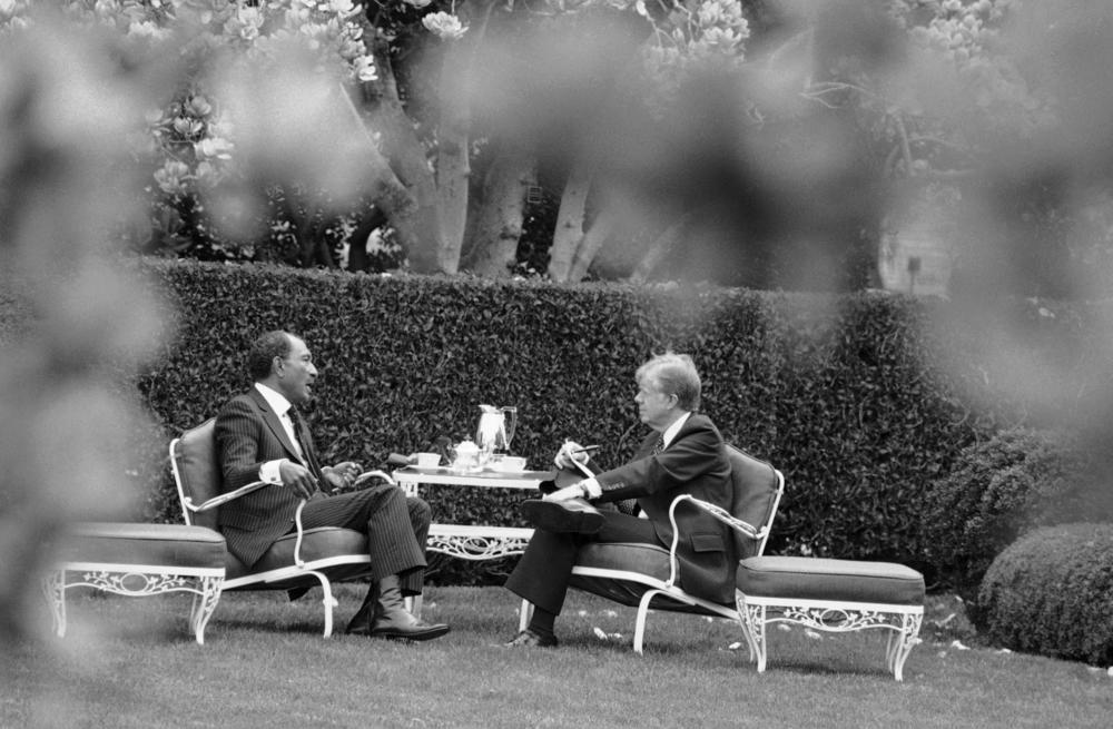 Egyptian President Anwar Sadat, left, and President Jimmy Carter together in Washington DC. Carter was instrumental in bringing Sadat together with Israel's Menachem Begin in the Camp David Accords which formally established peace between Egypt and Israel. 
