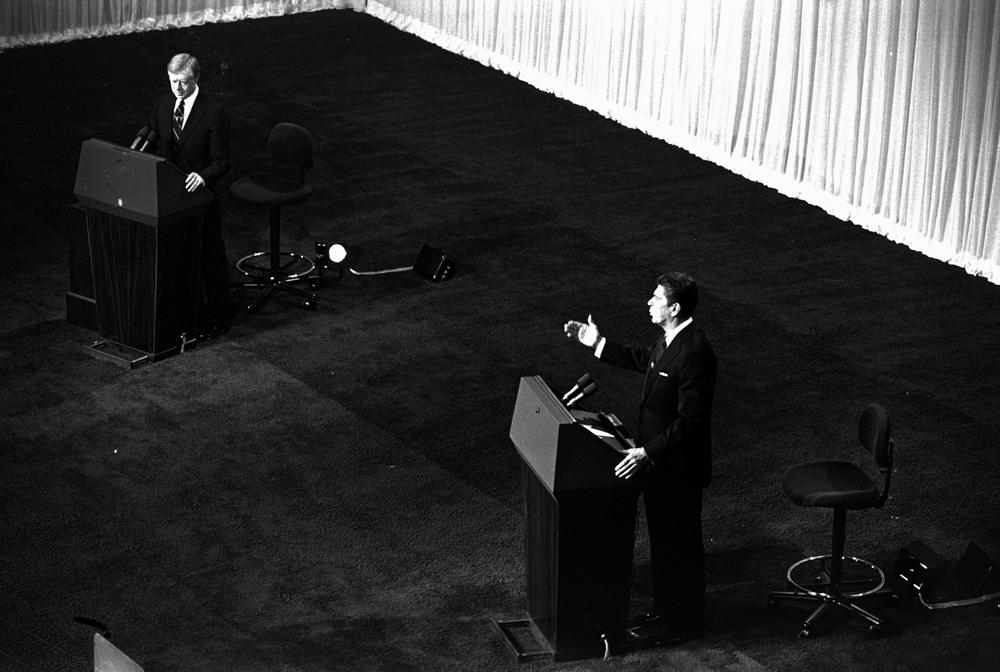 Republican presidential candidate Ronald Reagan, right, gestures as President Jimmy Carter listens during their debate, October 28, 1980, in Cleveland, Ohio. 