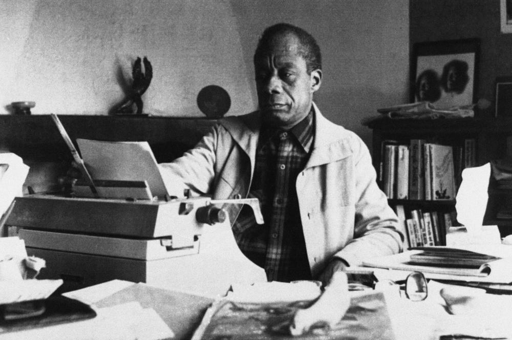 American writer James Baldwin poses in front of his typewriter in his house, March 15, 1983, in Saint Paul de Vence, France.