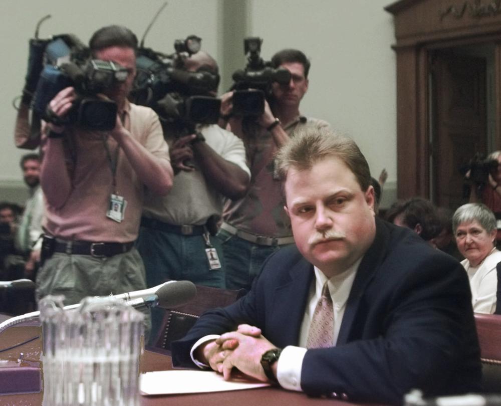 Photographers surround Richard Jewell prior to testifying before a House Judiciary subcommittee hearing on the 1996 Olympic bombing in Atlanta, July 30, 1997.