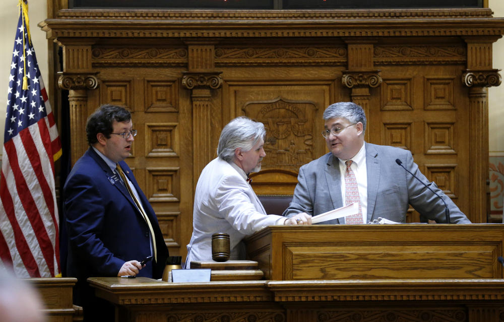 Sen. Josh McKoon, R-Columbus, left, and Sen. Greg Kirk, R-Americus, confer with Senate President Pro Temper David Shafer, R-Duluth, on the Senate floor, March 24, 2016, in Atlanta. 
