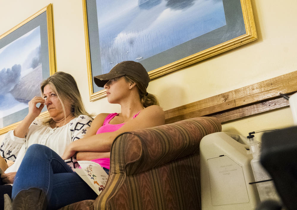 Cathy Bass, left, with her granddaughter Heaven Melton attended the bereavement ceremony at Gray Health And Rehabilitation in remembrance of Bass' brother, Timothy Marion Sanders. 