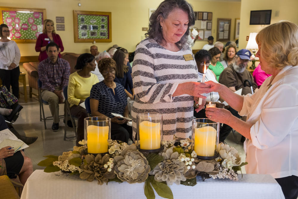 Staff members of the Gray Health And Rehabilitation assisted living home participate in the annual bereavement ceremony there when family members of deceased residents do not attend. 