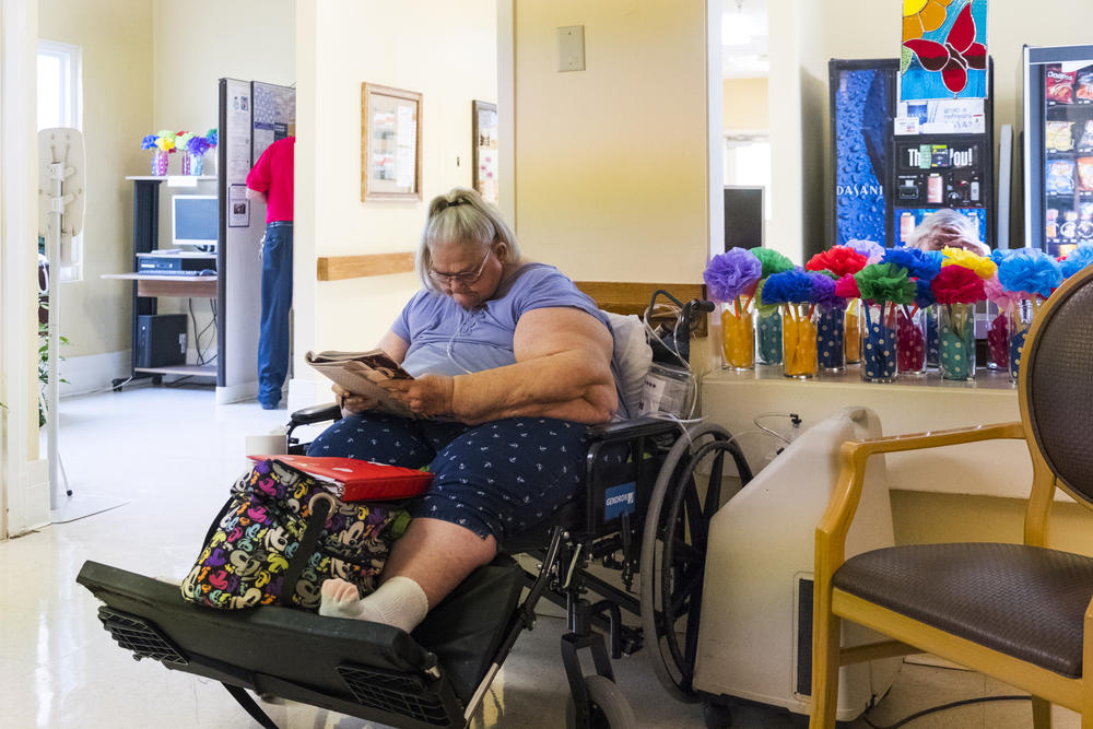 When a resident of Gray Health dies, resident Edna Williams makes a card she gets staff and residents alike to sign for the family. 