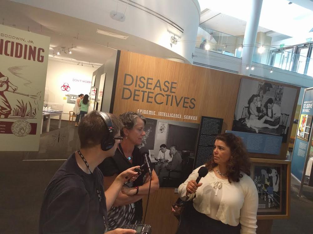 On Second Thought producer Sean Powers and host Celeste Headlee meet with Mary Hilpertshauser, the historic collections manager at the CDC's museum.
