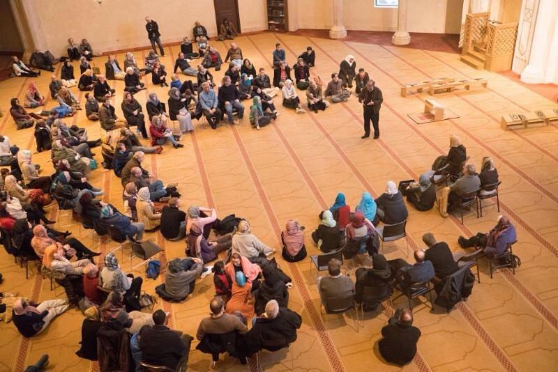 People gathered at Al-Farooq Masjid for a "Vist a Mosque" event hosted by the Islamic Speakers Bureau of Atlanta.