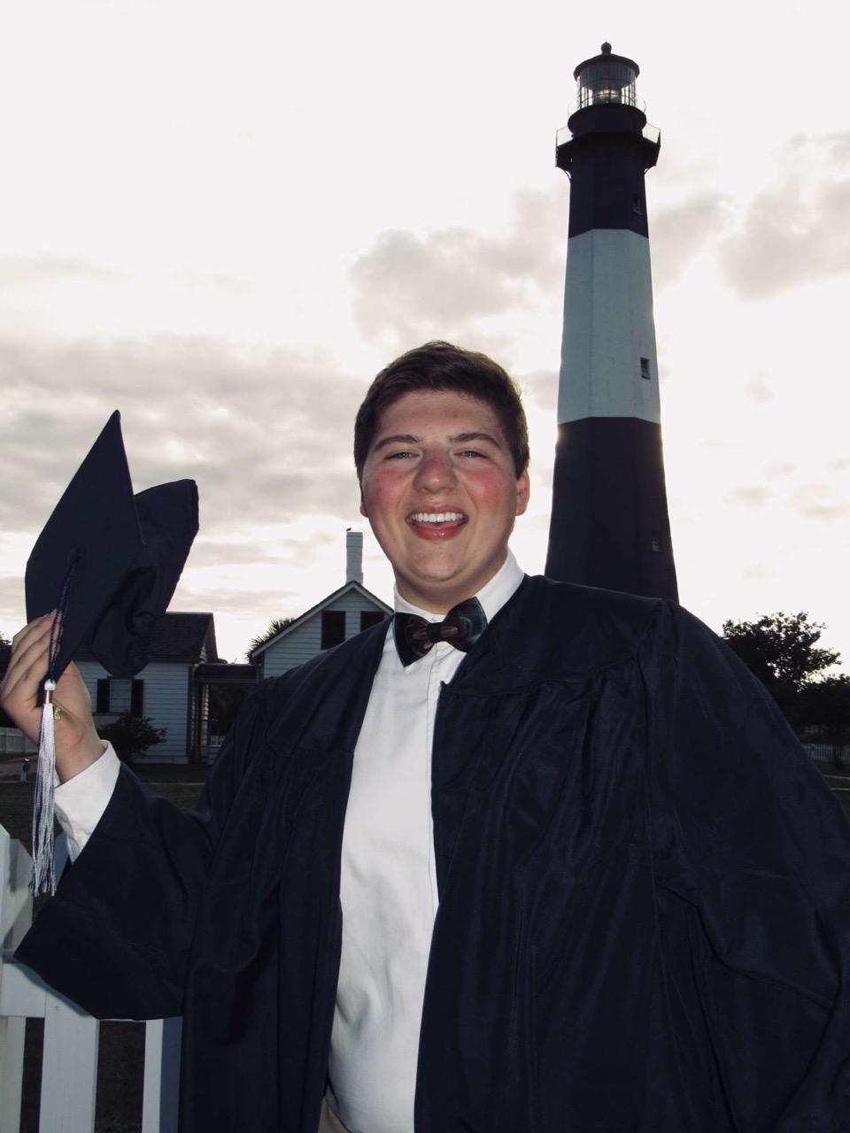 Carson Roberts dons his graduation robe for a celebratory photo in Effingham County.