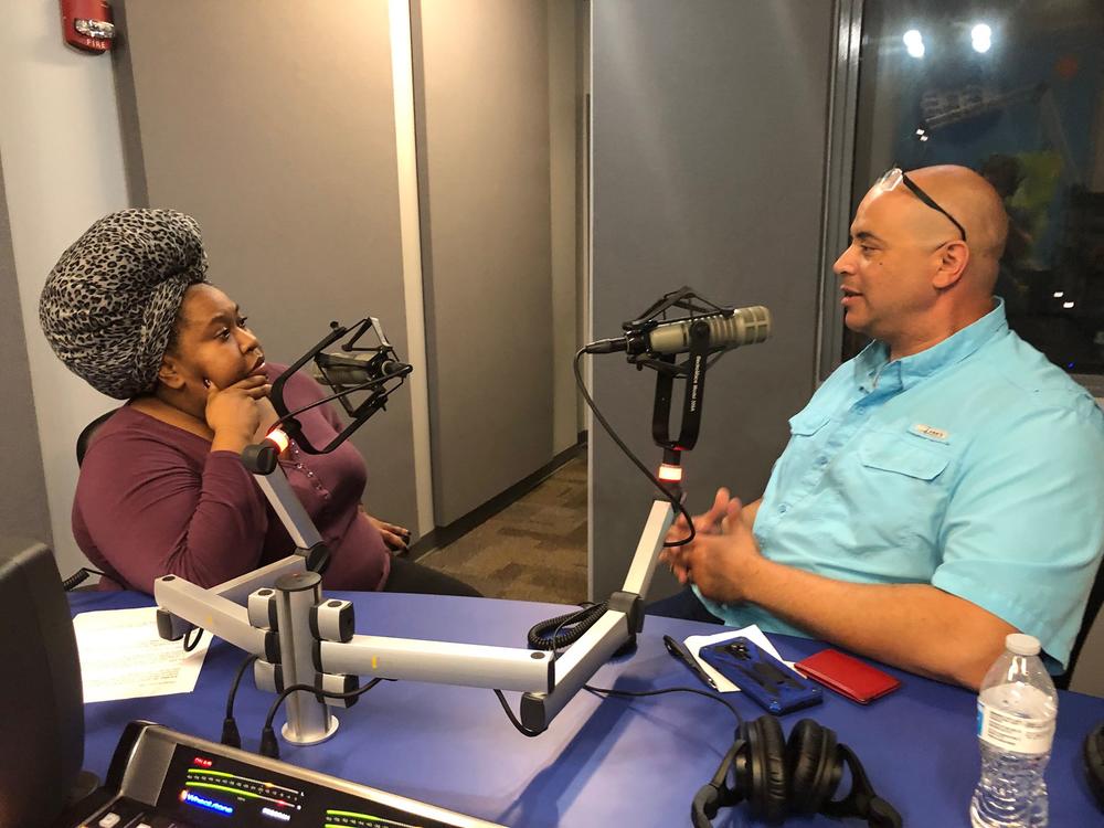 GPB's Kalena Boller talks with voice actor Bob Carter at Georgia Public Broadcasting.