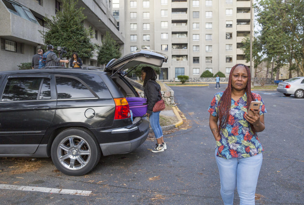 Residents of Crystal Lake Apartments pack up and make calls trying to arrange someplace to stay after their forced eviction due to unsafe living conditions. 