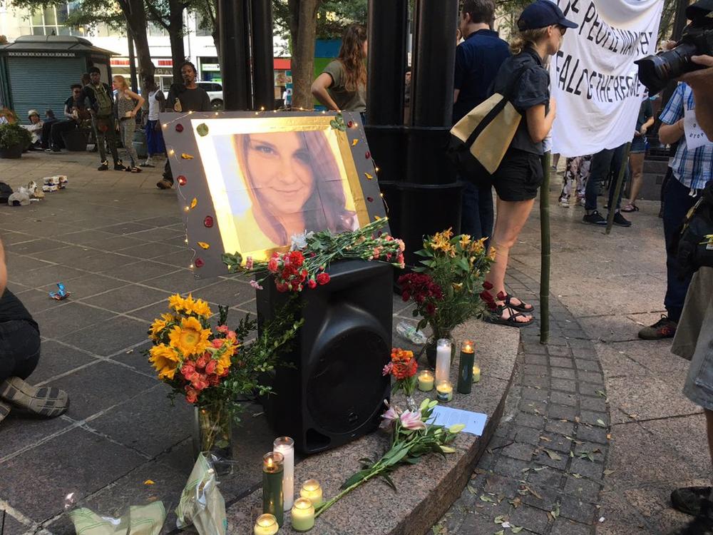 Demonstrators in Atlanta's Woodruff Park set up a memorial to Heather Heyer, who was killed when a car rammed a group of protesters in Charlottesville, Va. 