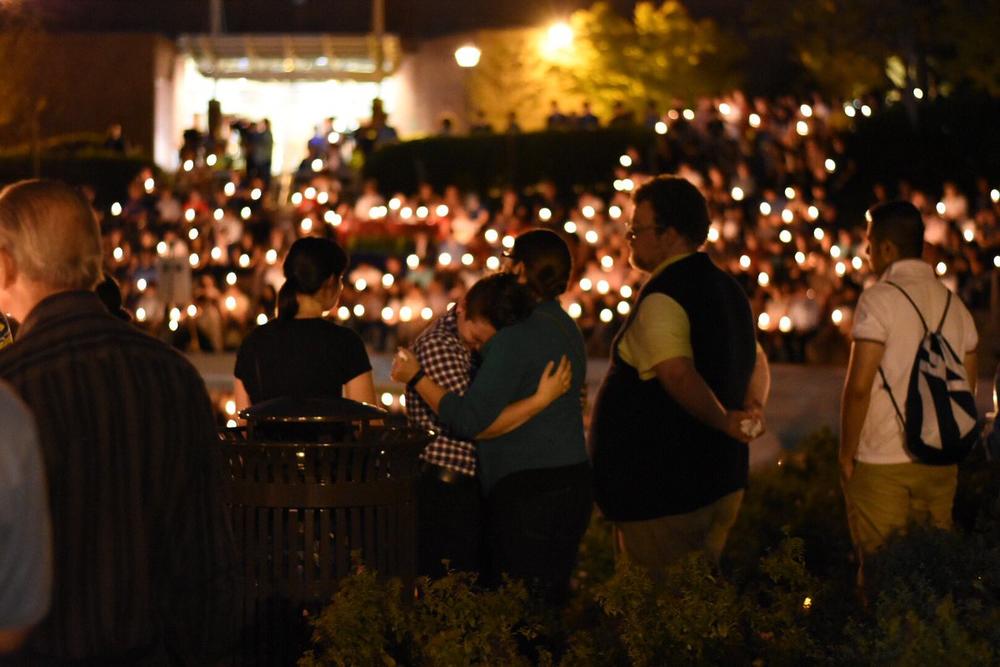 Community members mourn at a vigil for Scout Schultz, a Georgia Tech student fatally shot by campus police.