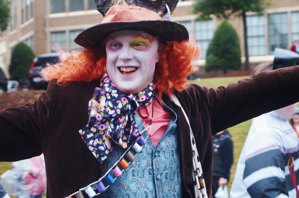 A parade participant dressed as The Mad Hatter from 