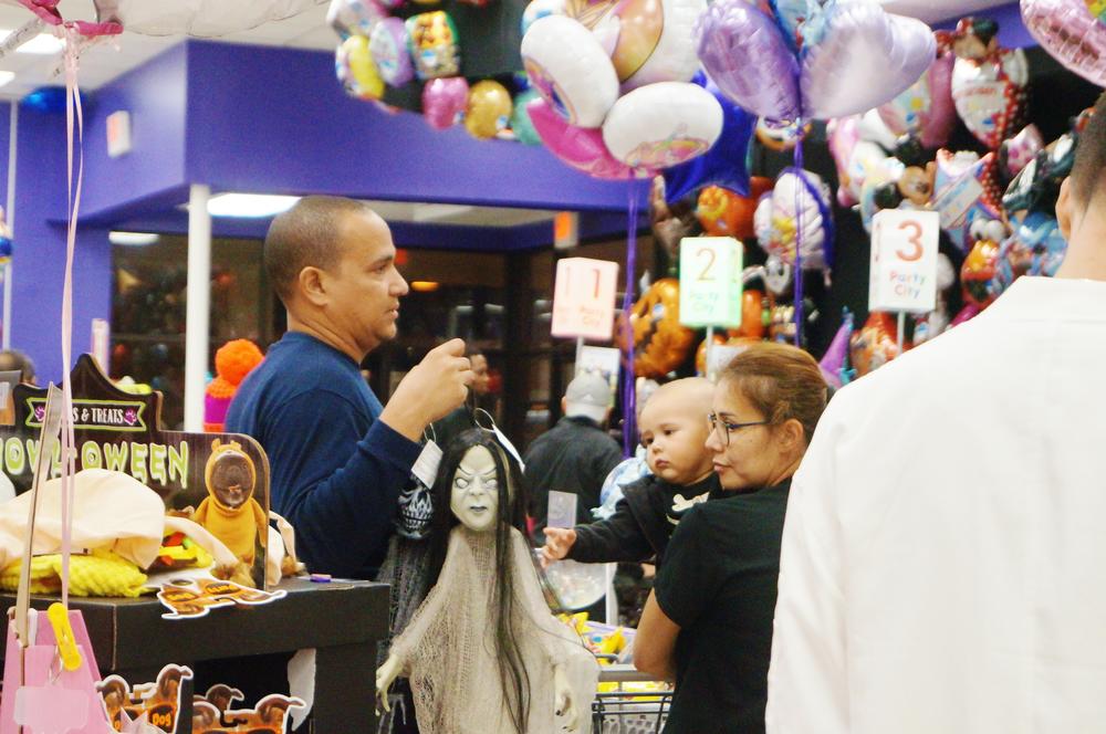 Customers were in line buying Halloween accessories. 
