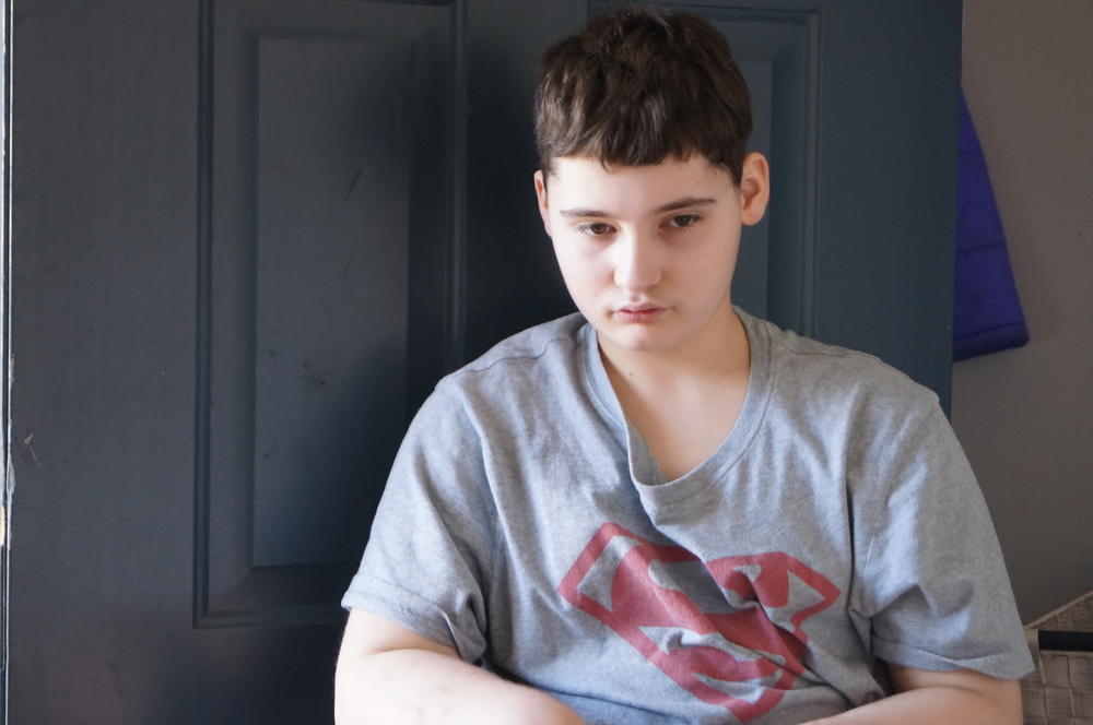 Johnathan sits at the front door.
