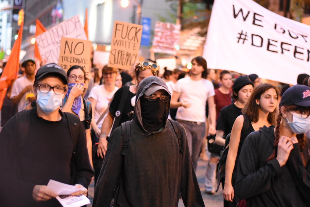 Several hundred people march down Peachtree Street in Atlanta