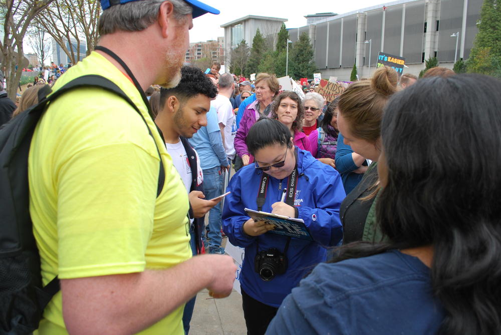 Voter registration volunteers were out in full force at the march.