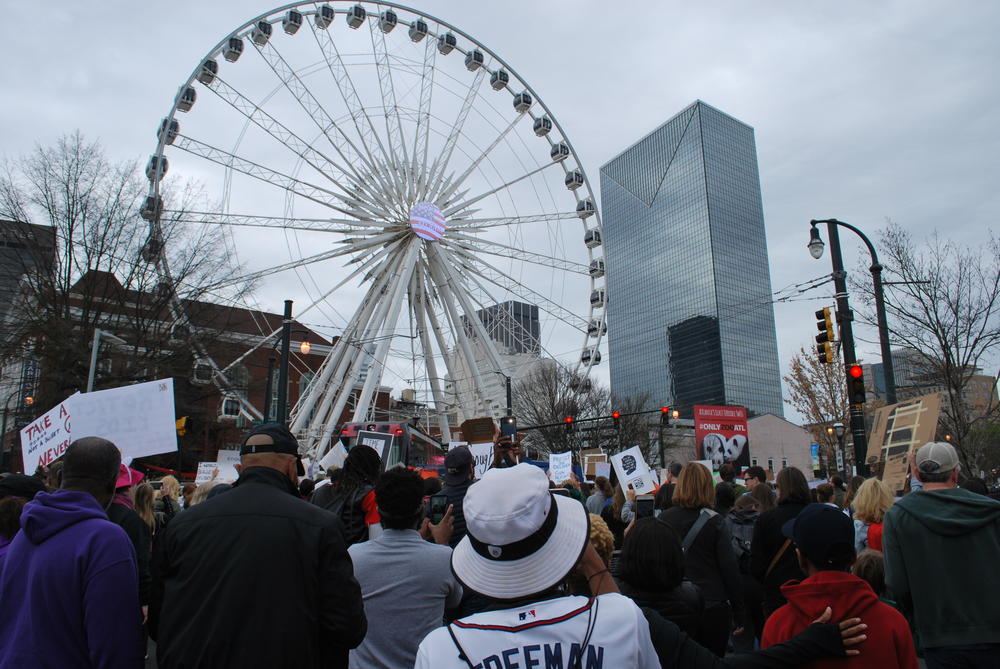 Crowds make their way past Atlanta's Olympic Centennial Park. 