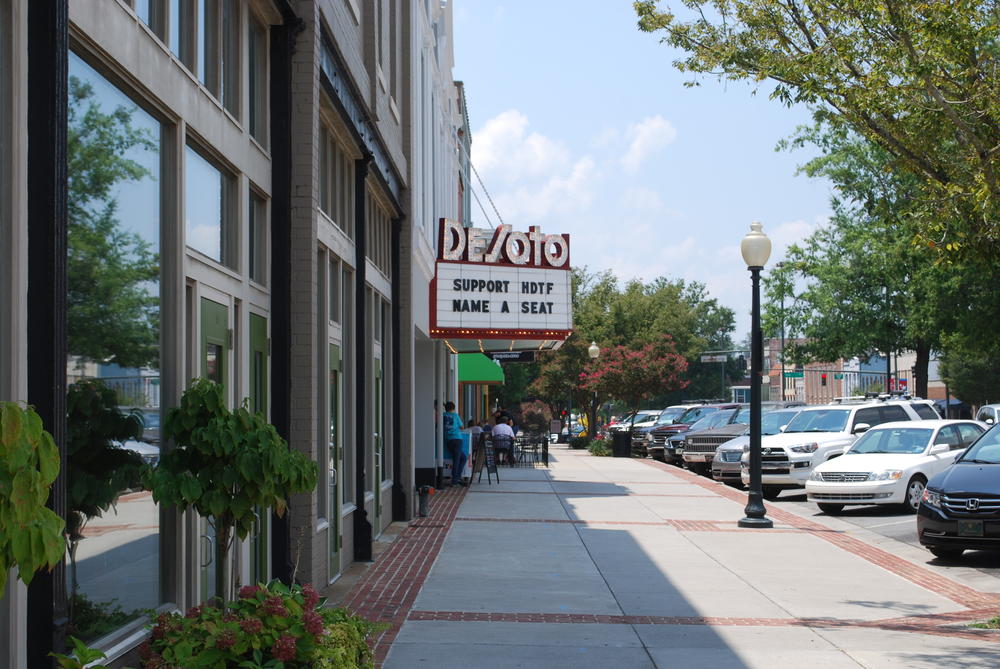 Above ground on Broad Street, with a view of the DeSoto Theatre. 