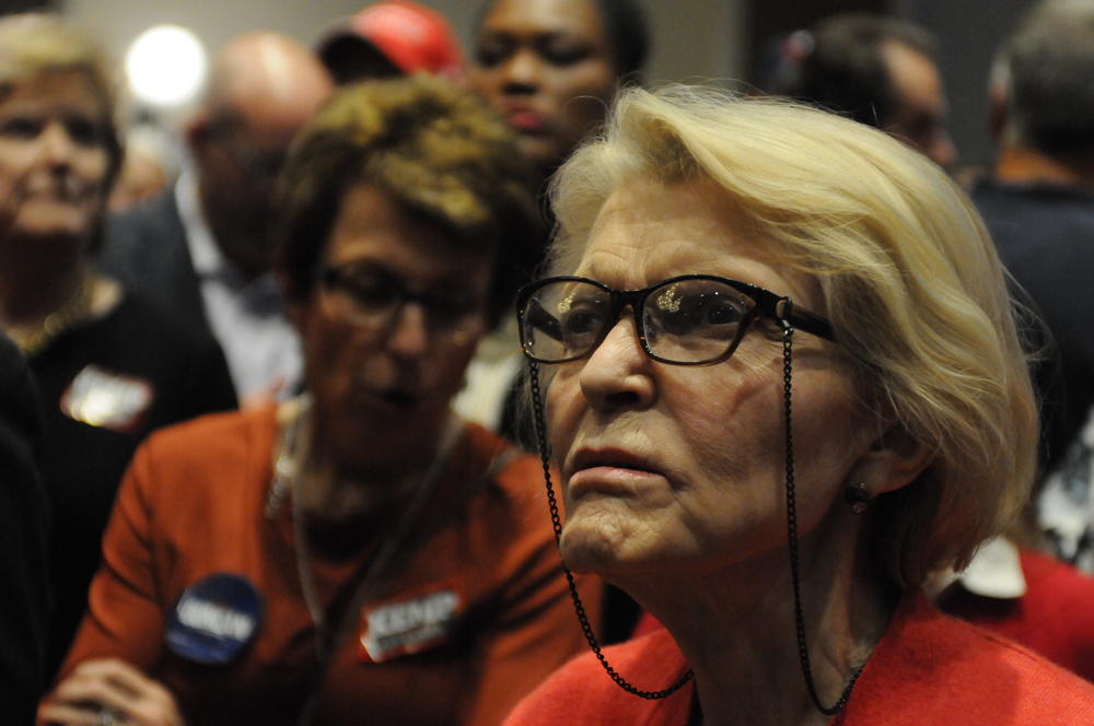 Republican State Rep. Susan Holmes waits as results come in during Brian Kemp's election night party.