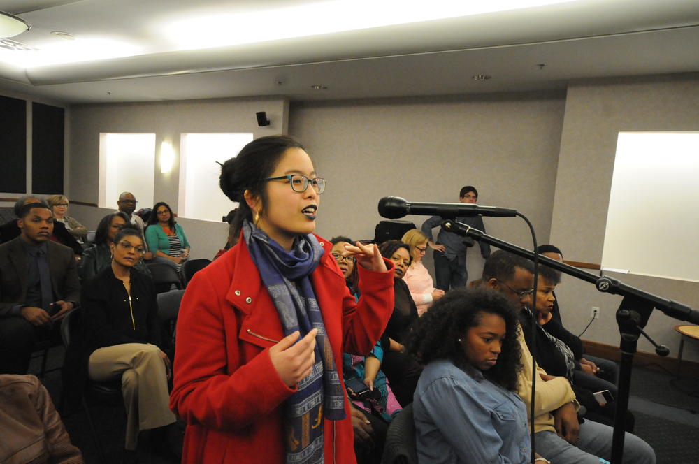 Audience member Connie Lo asks the panel a question.